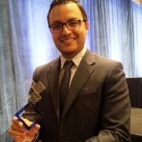 Ali Youssefi accepting Regional Transit Excellence Award
